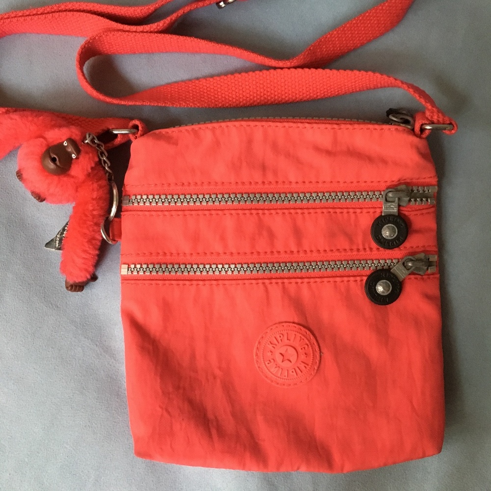 Kipling red crossbody bag.